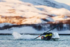 Gary practising a kayak roll in Arctic waters