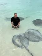Gary among stingrays in the shallows